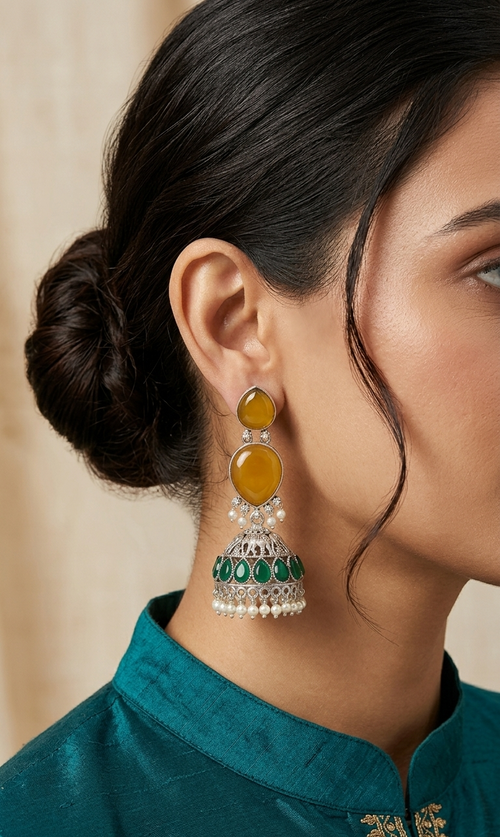 Close-up of a woman wearing a pair of earrings with a blurred background