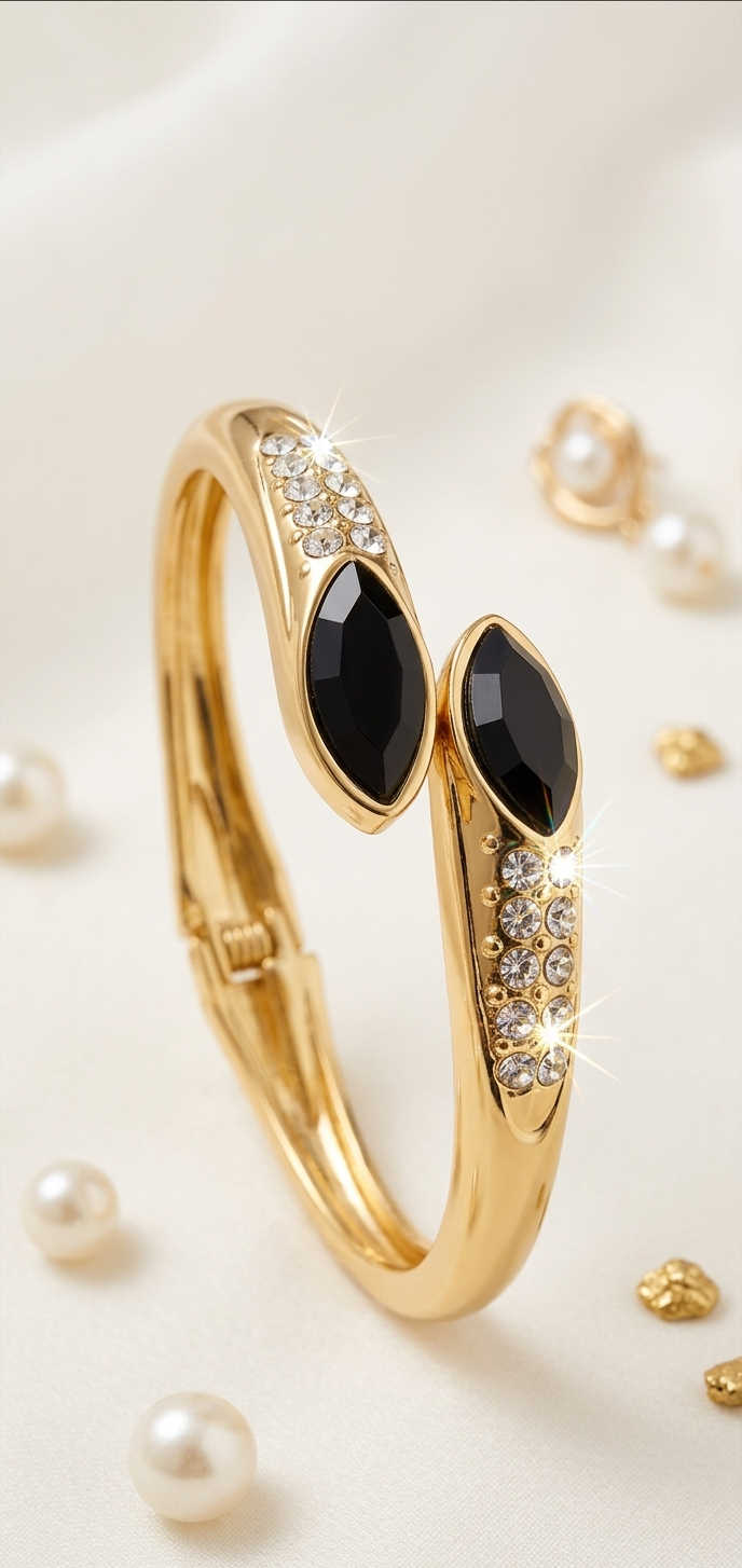 Gold bracelet with black stones and pearl beads on a white background