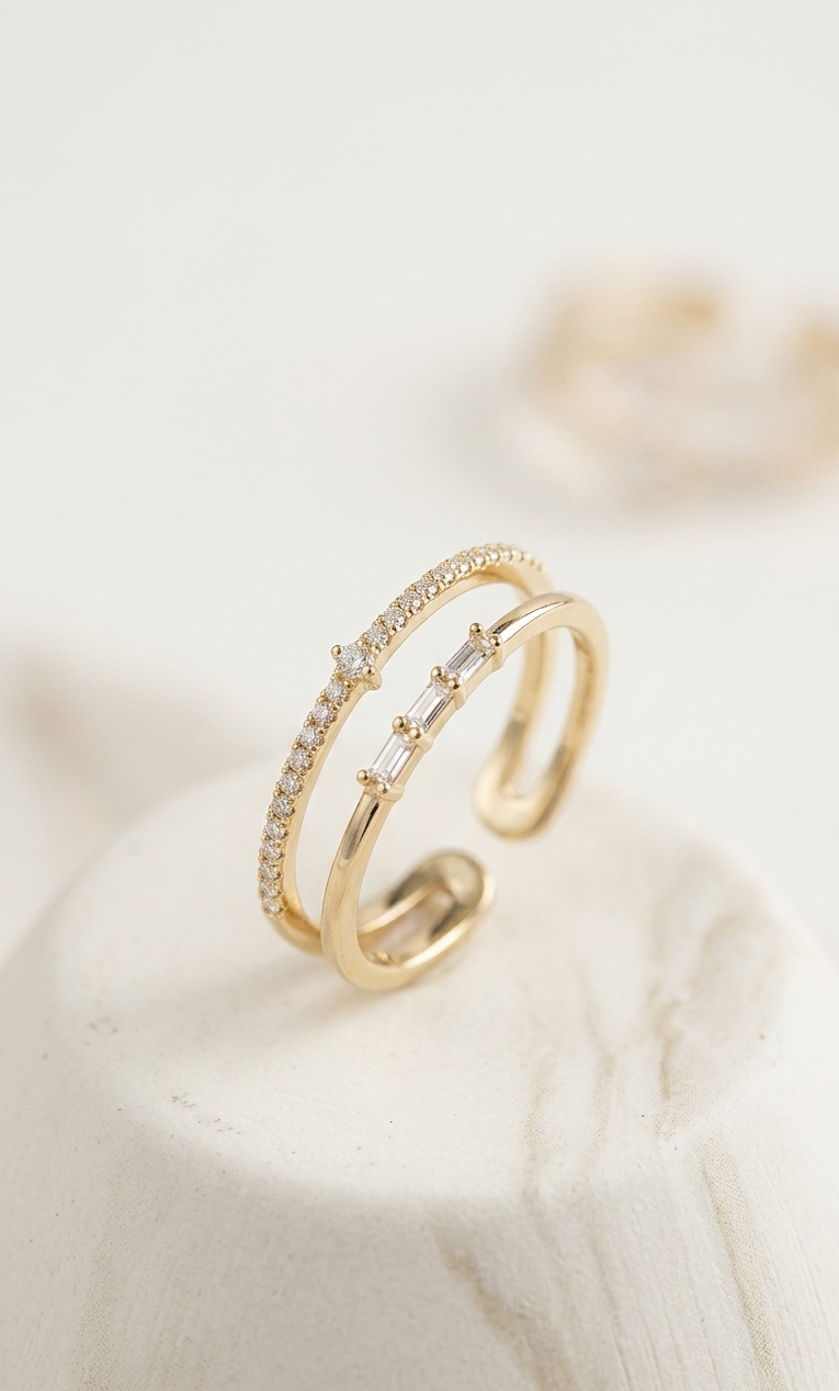 Gold open ring with small diamonds on a soft white background