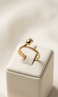 Gold ring with a pearl on a white box